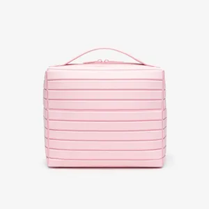 Pink striped makeup bag with top handle and zipper closure, perfect for travel and daily use.