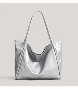 Silver PU leather tote bag detail, metallic shoulder bag texture, daily commute minimalist style.