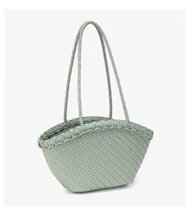 Green woven handbag tote detail showing intricate basket weave pattern and double shoulder straps.