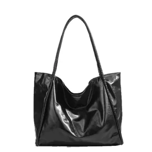 Black glossy tote bag for women, large capacity shoulder bag, stylish commuter handbag.