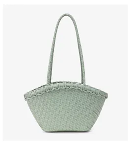 Light green woven leather tote bag detail, featuring intrecciato pattern handles.