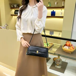 Stylish black crocodile pattern baguette shoulder bag, minimalist chic design for daily wear.