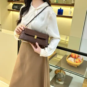 Brown crocodile pattern baguette shoulder bag, detailed view showing premium leather texture.