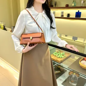 Stylish brown PU leather baguette underarm shoulder bag, minimalist casual daily accessory.