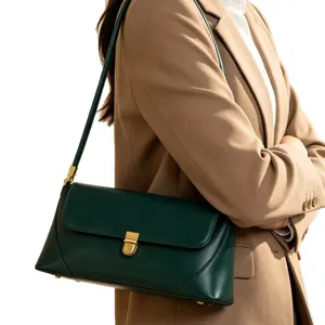 Chic dark green leather baguette shoulder bag for women, stylish minimalist underarm purse.