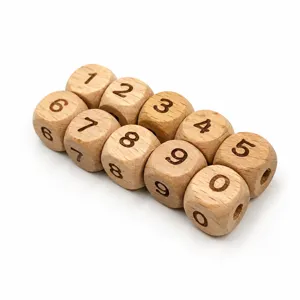 Detail view of 12mm natural beech wood square number dice beads with laser engraved digits.