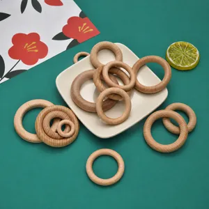 Wooden rings detail shot showing natural beech wood texture, smooth surface and various sizes.