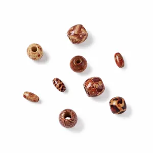 Detailed shot of assorted printed wooden beads for DIY hair accessories and jewelry making.