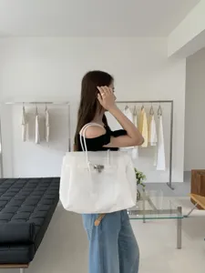 Large capacity white PVC jelly shoulder tote bag, stylish minimalist design for daily use.