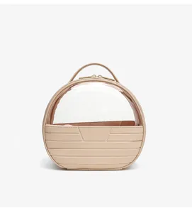 Portable clear dome cosmetic bag with elegant beige design, perfect for travel and daily use.