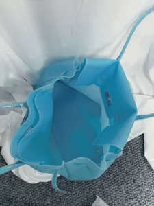 Blue PVC jelly shoulder bag, large capacity tote bag with top handle and metal lock.