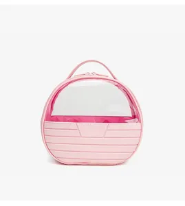 Pink round cosmetic bag with clear top window, portable travel makeup organizer, detail view.