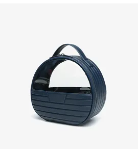 Dark blue round cosmetic handbag with clear front window, portable travel makeup storage bag.