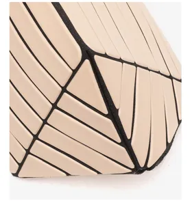 Geometric diamond pattern detail shot of portable fashion cosmetic handbag for women and daily use.