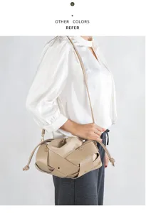 Woven dumpling shoulder bag for women, retro crossbody purse with soft leather drawstring.
