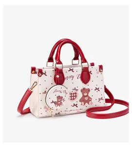 Cute bear print PU leather shoulder bag for women, stylish red trim crossbody handbag with purse.