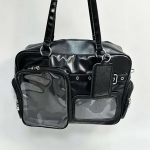 Black ita bag detail showing clear window pocket and premium PU leather material texture.