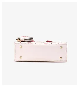 Cute cartoon bear print handbag bottom view detail, premium commuter crossbody shoulder bag.