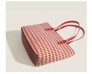 Elegant red and white houndstooth tote bag with red leather straps and large capacity.