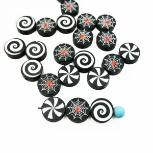 Detailed close-up of Halloween printed wooden beads featuring spider web and spiral patterns.