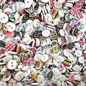 Detailed view showing a bulk assortment of mixed 15mm wooden buttons with floral and animal prints.