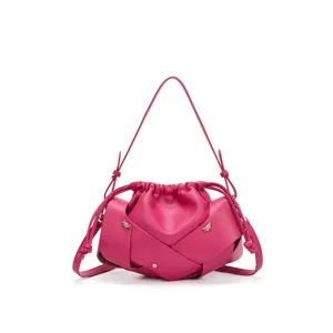 Pink leather shoulder bag for women, stylish pleated drawstring crossbody handbag with metal decor.
