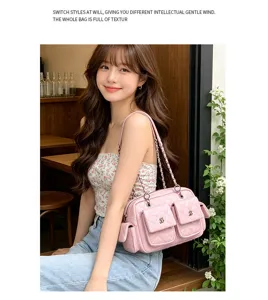 Pink quilted shoulder bag with chain strap and multiple front pockets for women daily use.