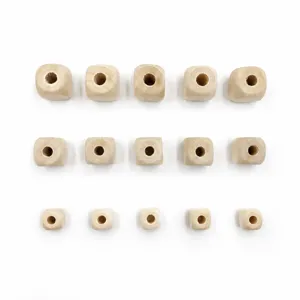 Detail view of DIY natural wood square beads, unpainted craft blocks for jewelry making.