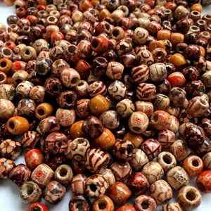 Close-up details of mixed color wooden beads, large hole craft beads for DIY hair braids.