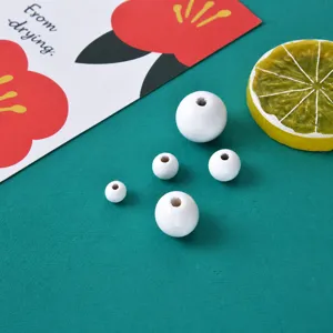 White wooden beads for DIY jewelry making, eco-friendly round loose beads in various sizes.