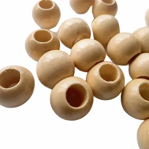 Close-up of natural wooden beads with large holes, varnished for DIY jewelry making.