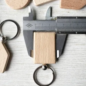 Detailed view of solid beech wood rectangular DIY keychain pendant with metal ring sizing.