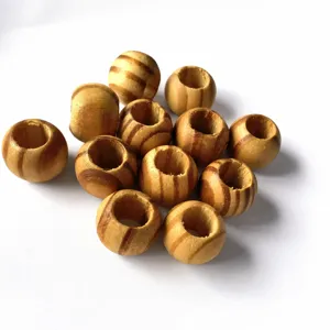 Detail view of large hole pine wood round beads, natural wood grain diy craft accessories.