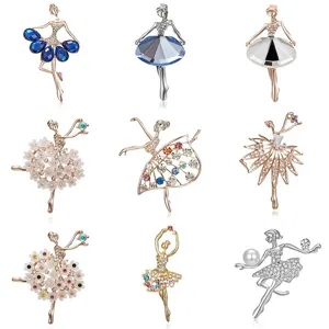 Close-up details of elegant ballerina brooches showcasing sparkling rhinestone craftsmanship.