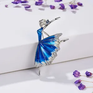 Close-up detail of elegant blue enamel rhinestone ballerina dancer brooch on display.