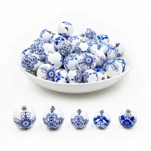 Detailed shot of 20mm blue and white porcelain style printed wooden beads for handmade DIY craft.
