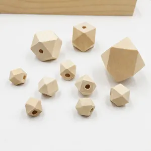 Close-up of natural wooden geometric beads, multi-faceted diy craft jewelry accessories.