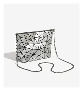 Silver geometric lattice chain crossbody bag, chic minimalist style for daily commute.