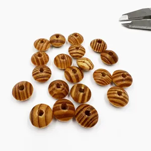 Close-up of natural wooden spacer beads, abacus shaped beads for DIY jewelry making and crafts.