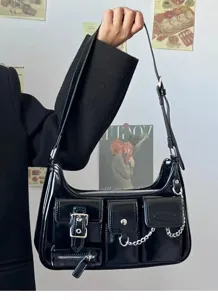 Black patent leather shoulder bag detail, Y2K retro multi-pocket design with chic chain.