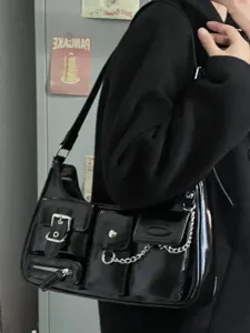 Trendy Y2K motorcycle shoulder bag for women, black patent leather purse with chains.