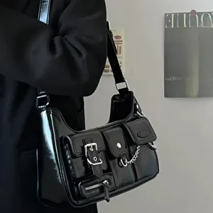 Black Y2K patent leather shoulder bag with multi pockets, metal buckles, and chain strap.