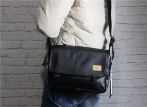 Detailed view of retro black men leather messenger bag, vintage crossbody casual style.