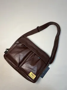 Stylish dark brown faux leather messenger bag for men, casual crossbody bag with adjustable strap.