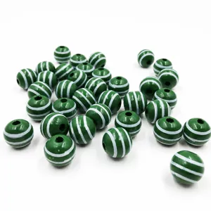 Detailed shot of 16mm green striped wooden beads, perfect for handmade DIY jewelry accessories.