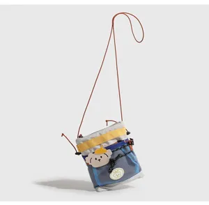 Borsa a tracolla stile campeggio cucciolo di cartone con rete blu, custodia telefono.