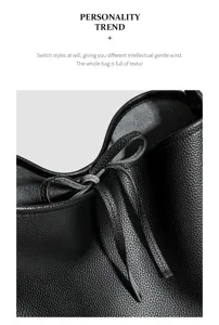 Primer plano detallado del bolso saco de piel negra con textura fina y elegante diseño.
