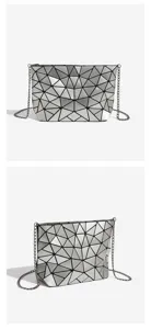 Detail view of the silver geometric lattice crossbody bag showcasing its unique triangular folding design.