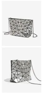 Geometric lattice shoulder bag featuring reflective silver triangular panels and dark chain.