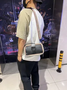 Men stylish crossbody bag with vintage striped strap and leather contrast design for daily use.